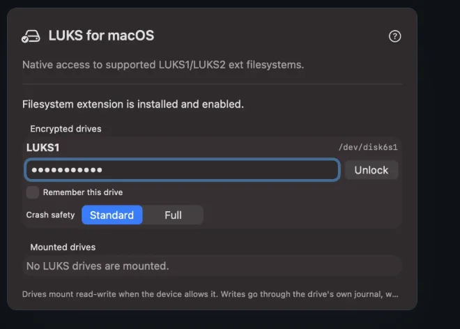 The Luksmith window with a LUKS1 drive selected, a passphrase field, a Remember this drive checkbox, and a Standard / Full crash-safety choice.